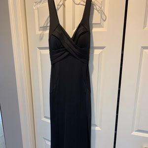 Full length black dress with slit.